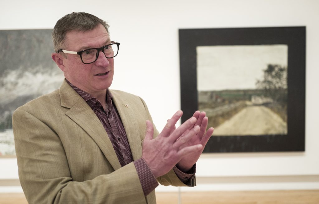 Dick Averns, Curatorial Coordinator at The Military Museums, discusses the artwork of war artist Bill MacDonnell at the museum in Calgary, Wednesday, Oct. 16, 2024.THE CANADIAN PRESS/Jeff McIntosh