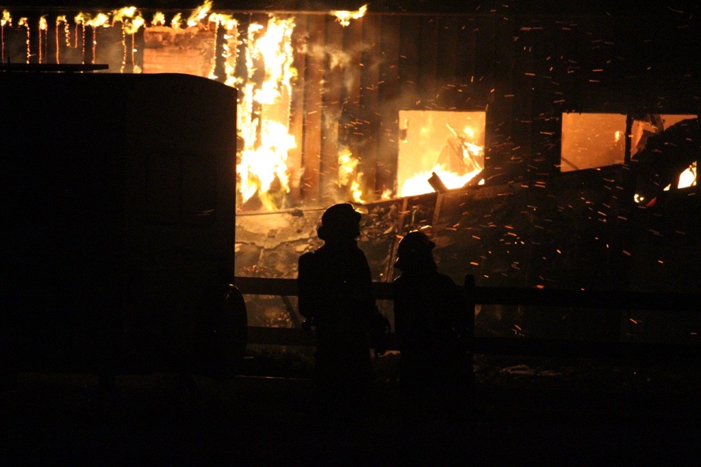 Two homes under construction in Cochrane were destroyed by fire Tuesday night. (Supplied/@calgary.emergency.vehicles)