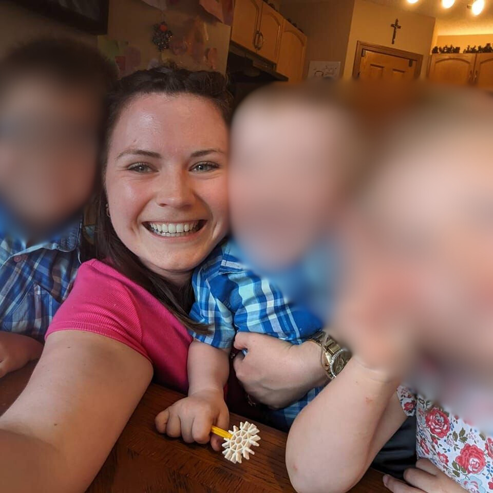 Ania Kaminiski takes a selfie with her three children in Calgary