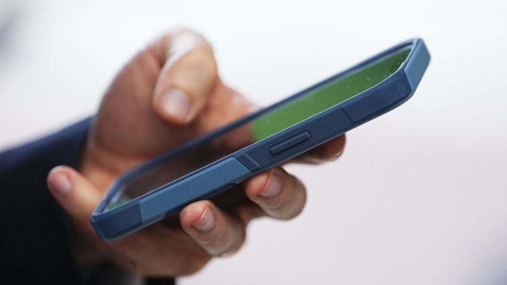 A person uses a cellphone in Ottawa on July 18, 2022. THE CANADIAN PRESS/Sean Kilpatrick