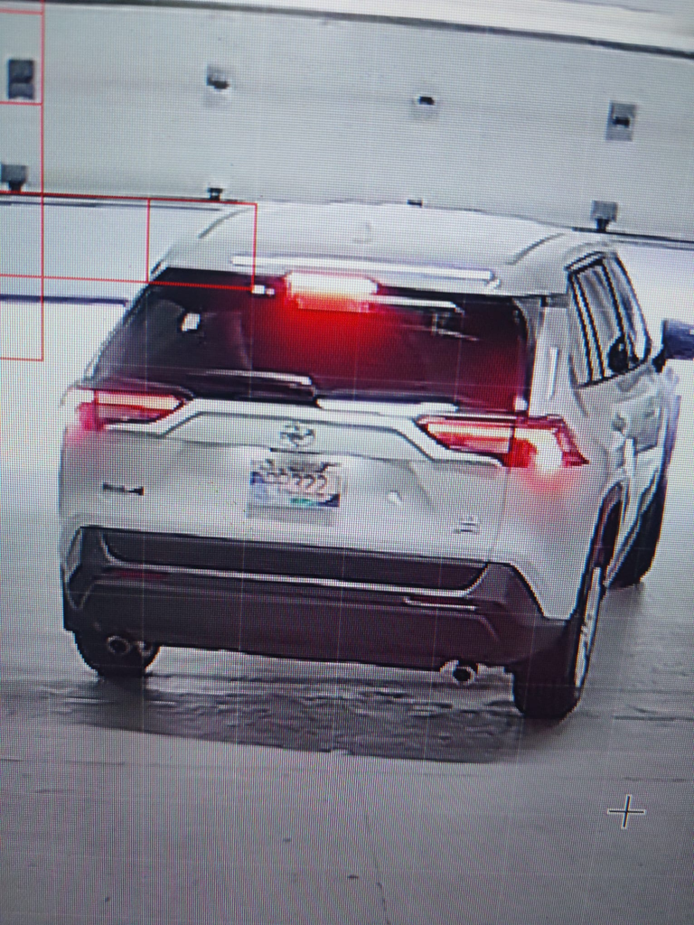 An image of a white Toyota captured on CCTV as it left a parking garage at a apartment building in southwest Calgary on Saturday, July 19, 2025