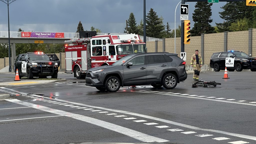 Emergency crews on scene of a crash involving a vehicle and an e-bike on 16 Avenue NW in Calgary on Aug. 20, 2025. (CityNews/Brooklyn Clark)