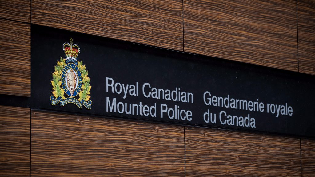 The RCMP logo is seen outside Royal Canadian Mounted Police "E" Division Headquarters, in Surrey, B.C., on Friday April 13, 2018. THE CANADIAN PRESS/Darryl Dyck
