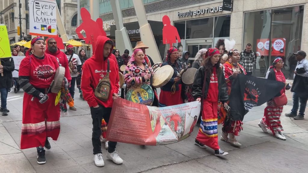 People march on Stephen Avenue in downtown Calgary for the Sisters in Spirit vigil on Saturday, Oct. 4, 2025.