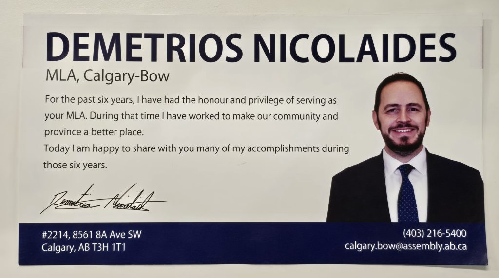A photo of a glossy postcard from Calgary-Bow MLA Demetrios Nicolaides handed out to his constituents in the area at the end of October 2025 taken on Sunday, Nov. 2, 2025
