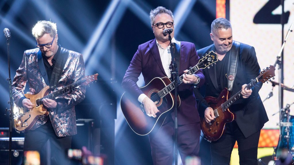 Kevin Hearn, left, and Ed Robertson, right, of the Barenaked Ladies, and former member and co-founder Steven Page, centre, perform during the Juno Awards in Vancouver, B.C., on Sunday March 25, 2018. THE CANADIAN PRESS/Darryl Dyck