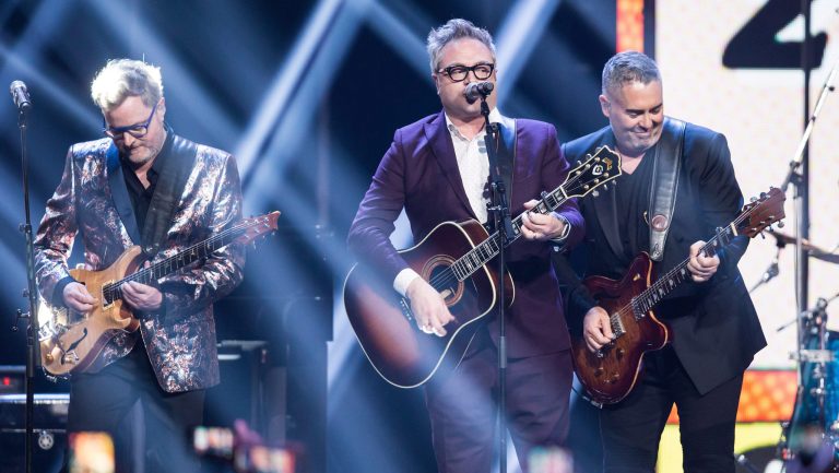 Kevin Hearn, left, and Ed Robertson, right, of the Barenaked Ladies, and former member and co-founder Steven Page, centre, perform during the Juno Awards in Vancouver, B.C., on Sunday March 25, 2018. THE CANADIAN PRESS/Darryl Dyck