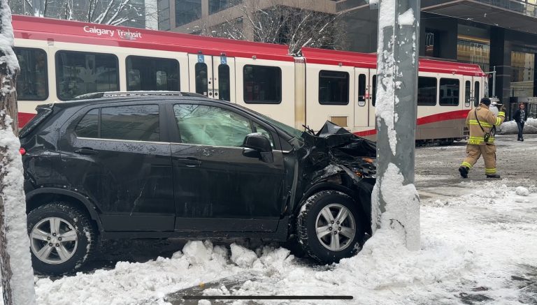 A vehicle struck a pole following a crash that shut down CTrain service along 7 Avenue SW on Nov. 24, 2025. (Matthew Johnson)