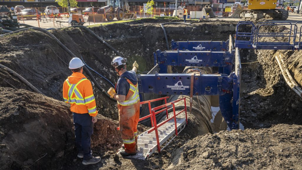 City of Calgary workers on the site of a feeder main break in Bowness in Calgary in June 2024. (Courtesy City of Calgary)