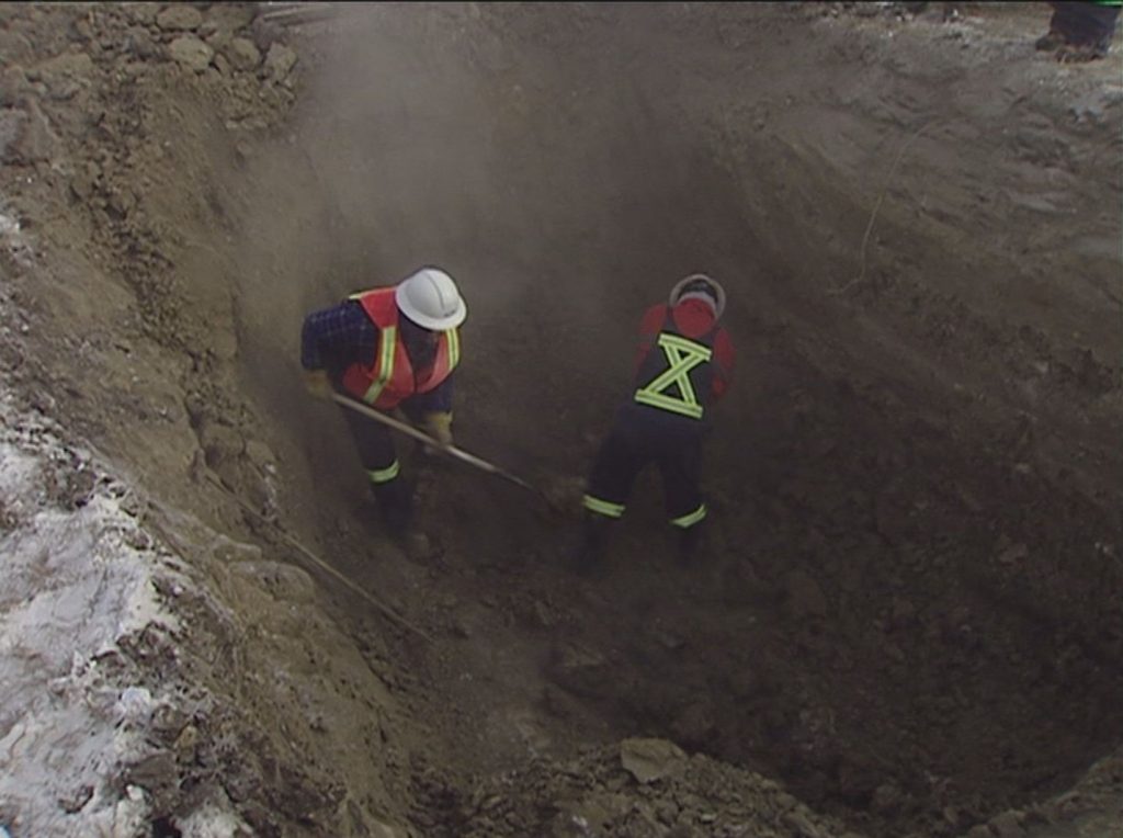 City of Calgary crew members work on the McKnight Feeder Main break in 2004