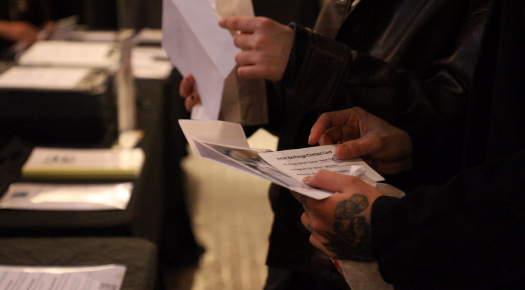 The Alcove and Exposure Photography Festival print exchange card held in the hands of a guest at Contemporary Calgary on Thursday, March 5, 2026