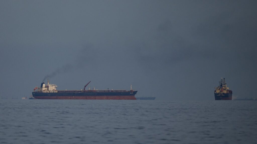 Oil tankers and cargo ships line up in the Strait of Hormuz as seen from Khor Fakkan, United Arab Emirates, Wednesday, March 11, 2026. (AP Photo/Altaf Qadri)