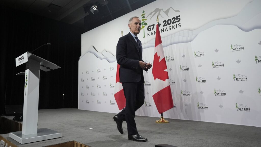 Prime Minister Mark Carney leaves the podium following the closing news conference at the G7 Summit in Kananaskis, Alta., Tuesday, June 17, 2025. THE CANADIAN PRESS/Adrian Wyld