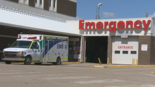 FILE - An EMS ambulance leaving an Alberta hospital emergency bay